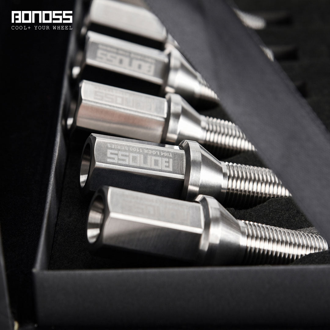 Close-up of silver titanium bmw wheel lug bolts with 'BONOSS' branding on a black background