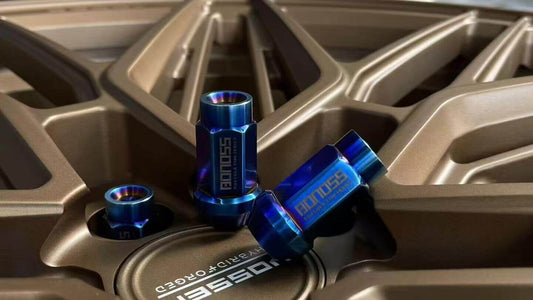 three blue titanium lug nuts put on the vossen aftermarket rims provided by customers 