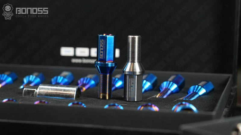 two titanium lug bolts from Aumotor's supplyer BONOSS stand on the box of product