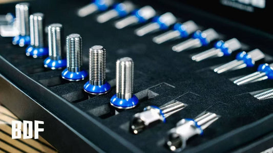 a set of porsche panamera titanium wheel bolts close-up details