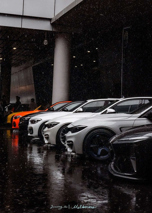 taken from Foshan APAxpo auto show outside while it is raining, the brand of the car appeared in the image including BMW, Mercedes, VW and Audi