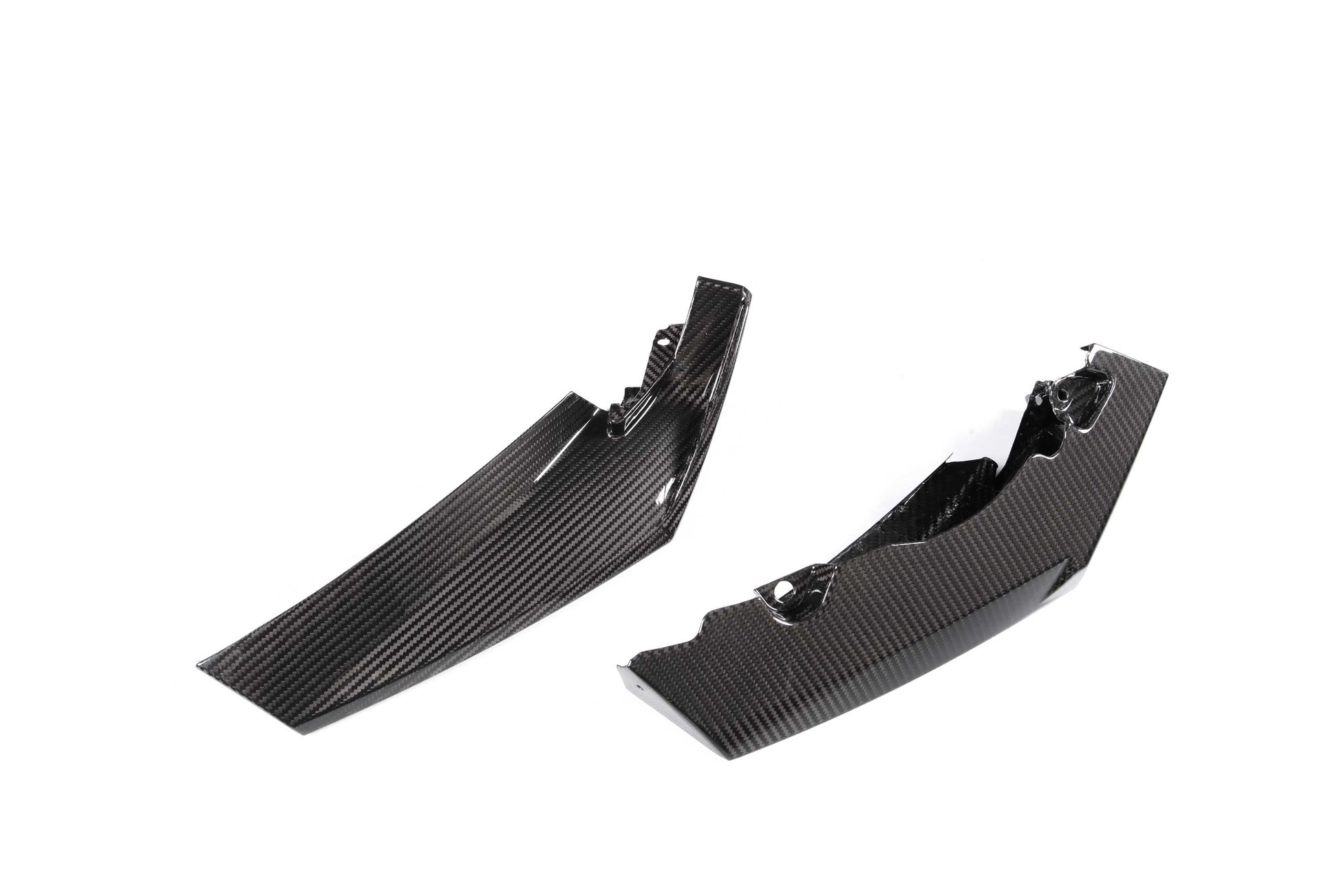 Two black carbon fiber winglets on a white background